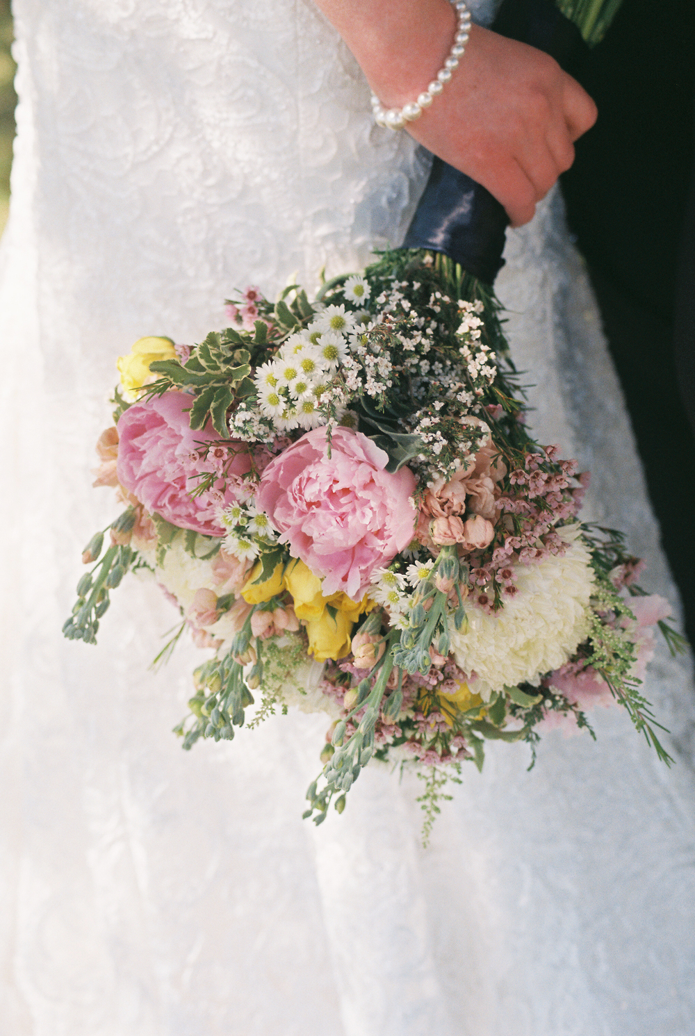 I took some photos at a recent wedding and adore this image. The colors, the grain. Swoon. 